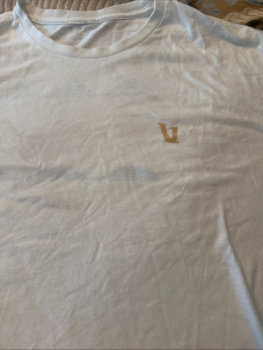 Vuori White Short Sleeve Tee with Gold Emblem